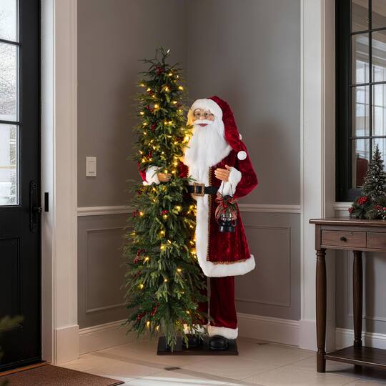 Glitzhome® 4ft. Oversized Traditional Christmas Santa with 5ft Lighted PE Dripping Christmas Tree